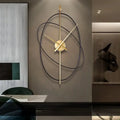 Reloj de pared moderno de metal abstracto dorado